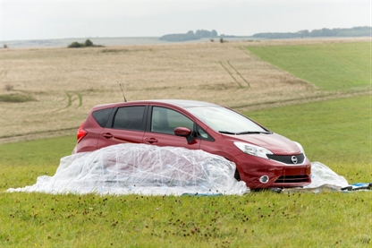 The Nissan Note is gradually enveloped in the CarZorb