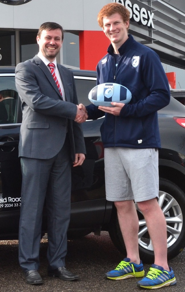 Gareth Howells, General Manager at Wessex Garages, left, with Cardiff Blues player, Rhys Patchell