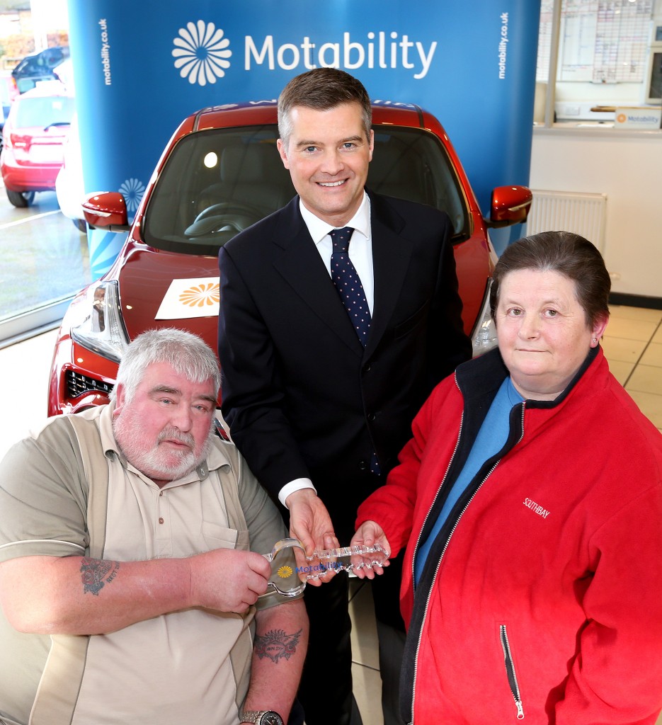Mark Harper MP presenting Mr and Mrs Boyle with the keys to their Nissan Juke on the Motability Scheme