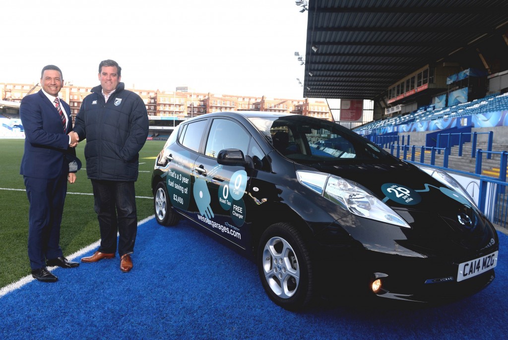 Justin Bell, Fleet Sales Manager at Wessex Garages, left, with Richard Holland, Chief Executive of the Cardiff Blues, and the Nissan Leaf that was donated as part of the sponsorship deal