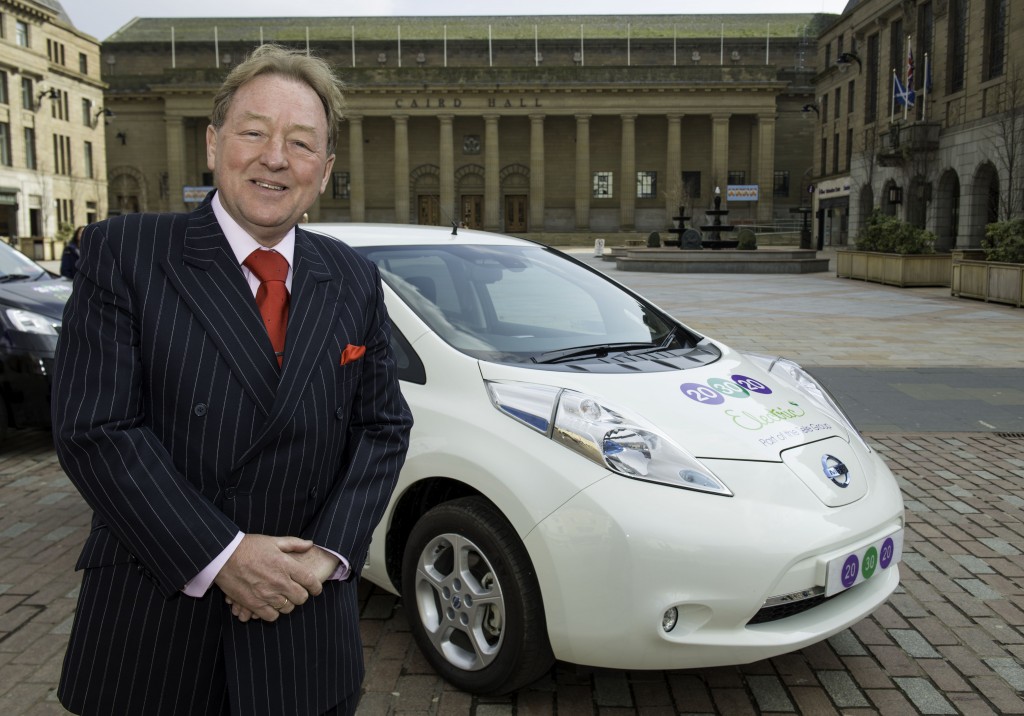 David Young, owner of 203020 Electric with one of his new fleet of 100% electric Nissan LEAF taxis.