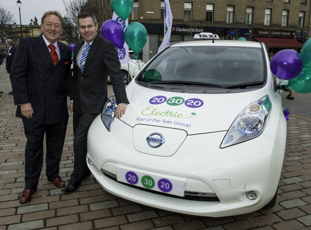 David Young, owner of 203020 Electric, (left) and Derek Mackay MSP, the Scottish Government’s Minister for Transport and the Islands, with one of the new 100% electric Nissan LEAF taxis.