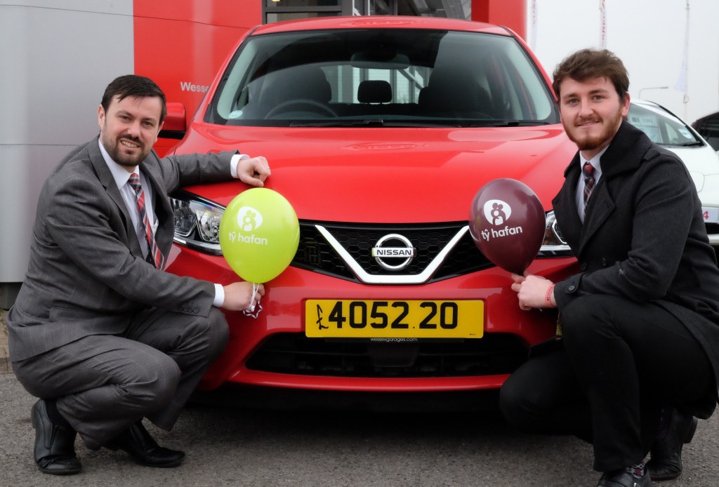 Gareth Howells, General Manager at Wessex Garages, left, and Matt Jones, Digital Sales Executive at the dealership, celebrate the amount raised for Tŷ Hafan during 2013 and 2014