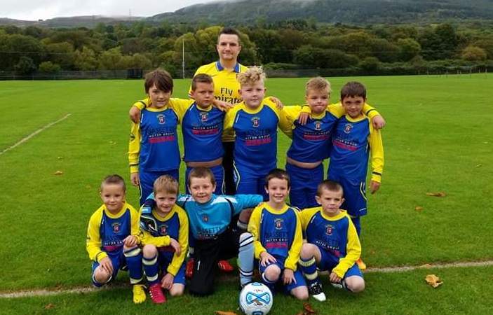 Youngsters from Cwmaman Institute Football Club in their new kit sponsored by Bassetts Nissan Swansea 