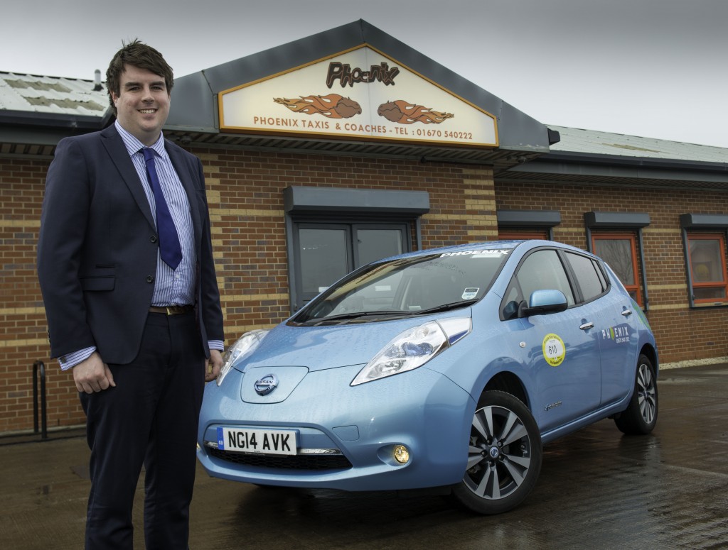 Alex Hurst, Managing Director at Phoenix Taxis, with one of his all-electric Nissan LEAF taxis