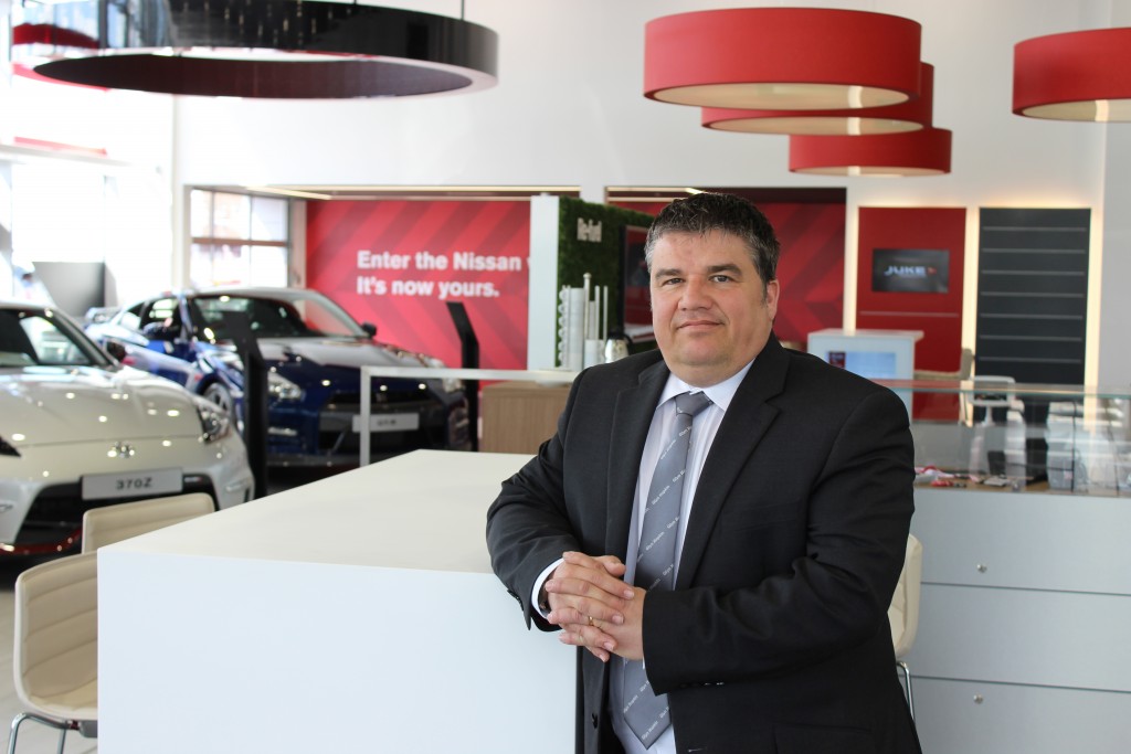 Sales Manager Mark Ellis at Glyn Hopkin’s new state-of-the-art Nissan Cambridge showroom in Newmarket Road
