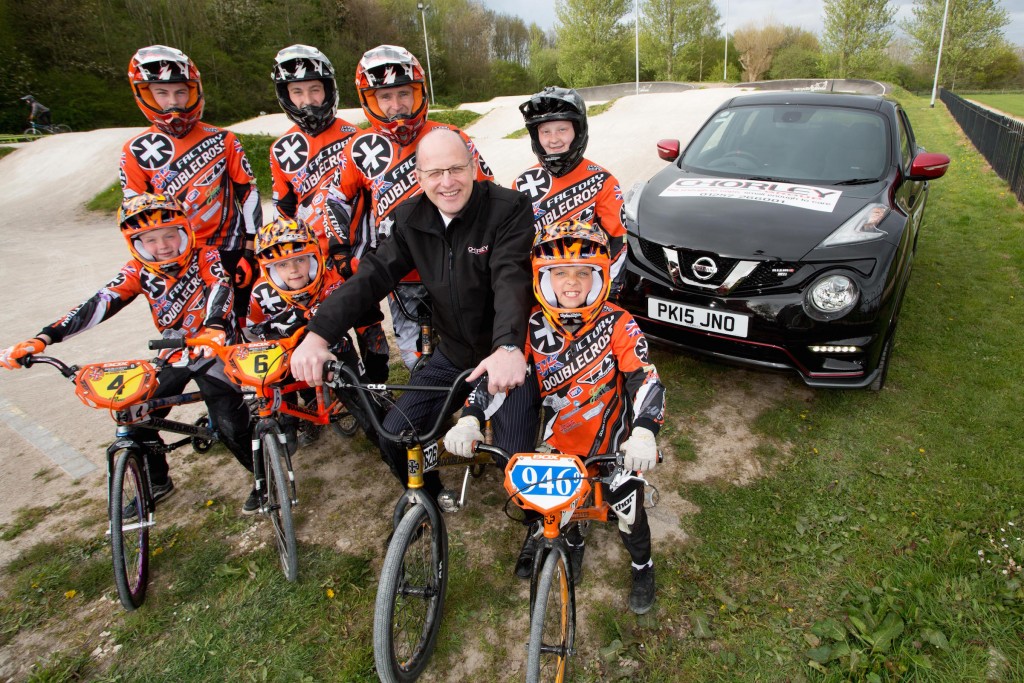 Alex Cullen, Sales Manager at the Chorley branch of the Chorley Group, with members of the Doublecross BMX team