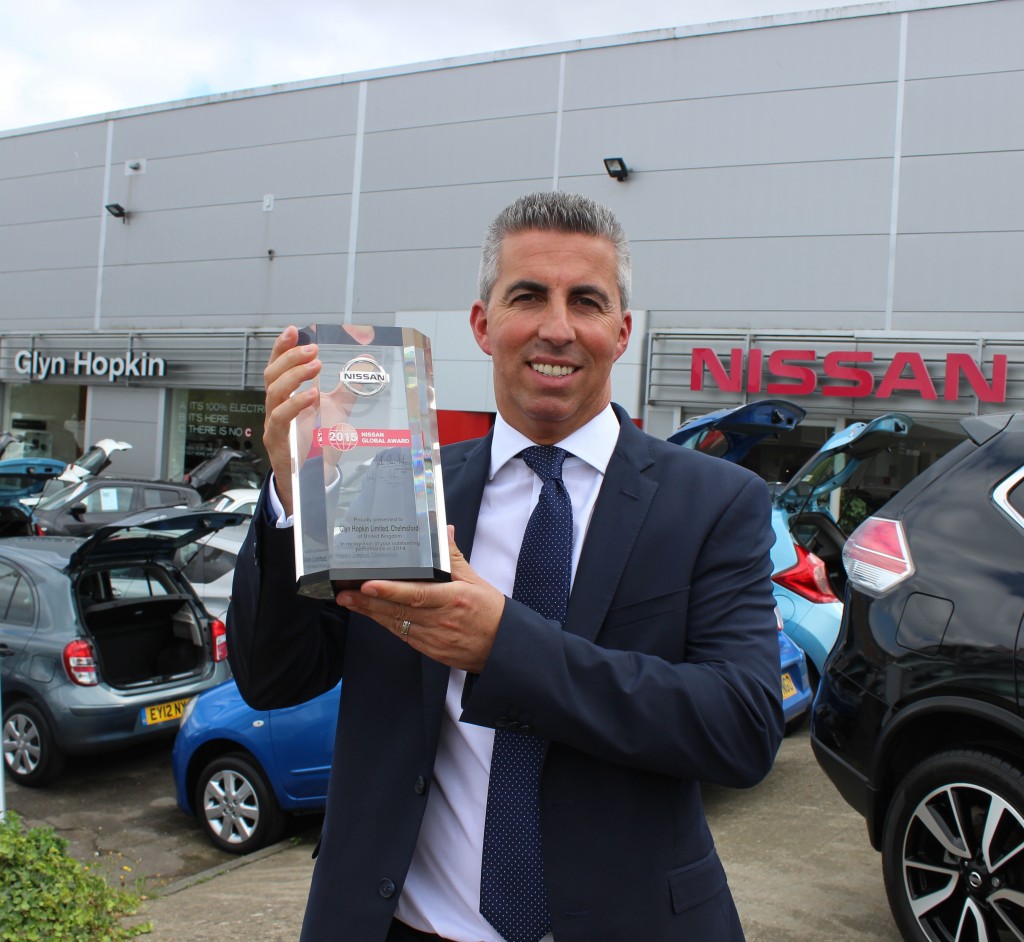 Fraser Cohen, Managing Director of Glyn Hopkin, with the Nissan Global Award given to the Chelmsford dealership