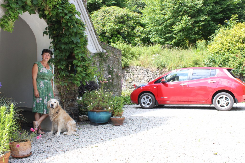 Sally Searle with the Nissan LEAF outside the B&B
