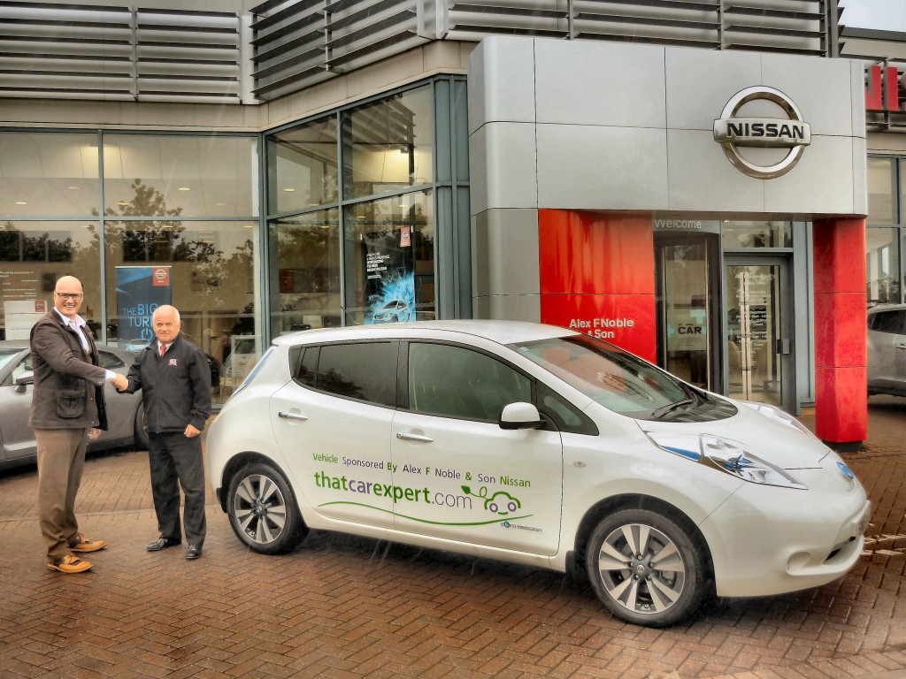 Gordon Campbell, sales manager at Alex F Noble & Son Nissan (right) presenting company ambassador, John Curtis with the keys to the specially commissioned all electric Nissan LEAF
