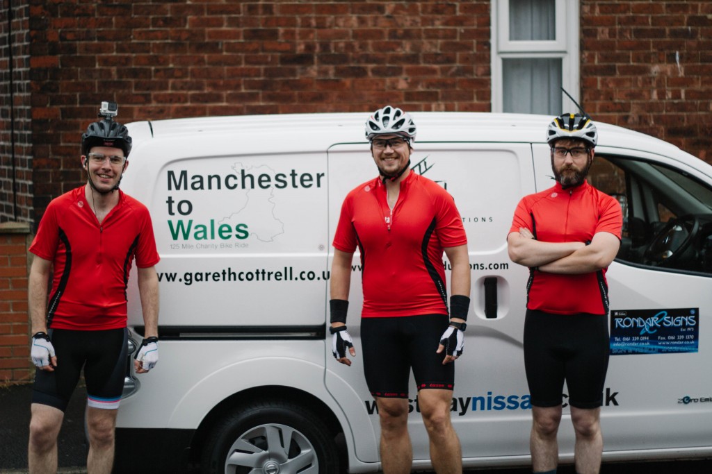 Gareth Cottrell, Bob Chrystal, and James Carter with the e-NV200 loaned to them by West Way Nissan Stockport for their 125-mile bike challenge