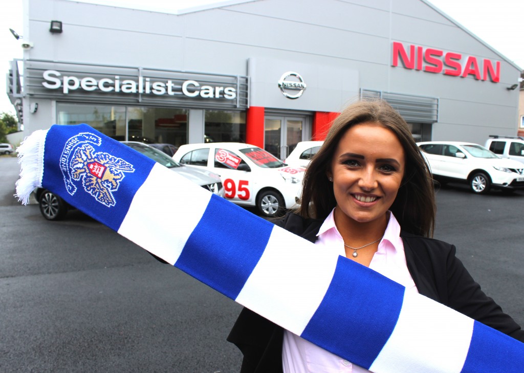 Showroom hostess Nicole Hughes, 18, with the St Johnstone FC scarf outside Specialist Cars Nissan in Perth
