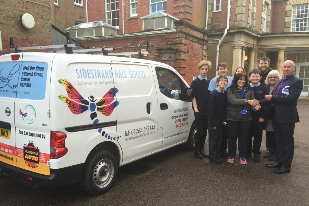 Kevin Abbs, Director at Crayford and Abbs Ltd, hands over the Nissan NV200 to Sidestrand Hall School 