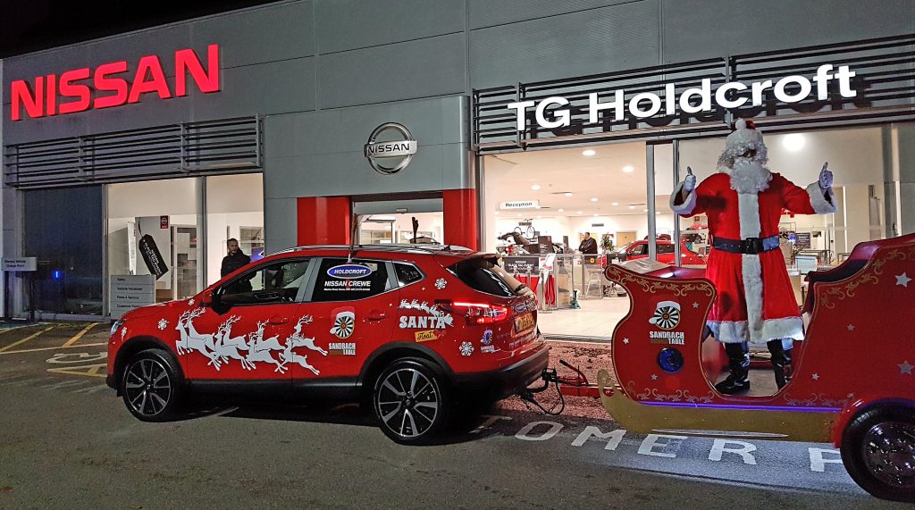 Staff at Holdcroft Nissan Crewe refurbished Sandbach Round Table's Santa Sleigh, and lent them a Nissan Qashqai to tow it.