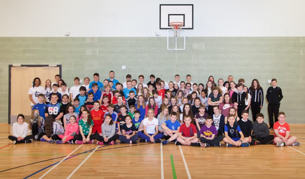 Eilish McColgan (seated front, centre) with participants at the event, organised by ANGUSalive and Mackie Motors 