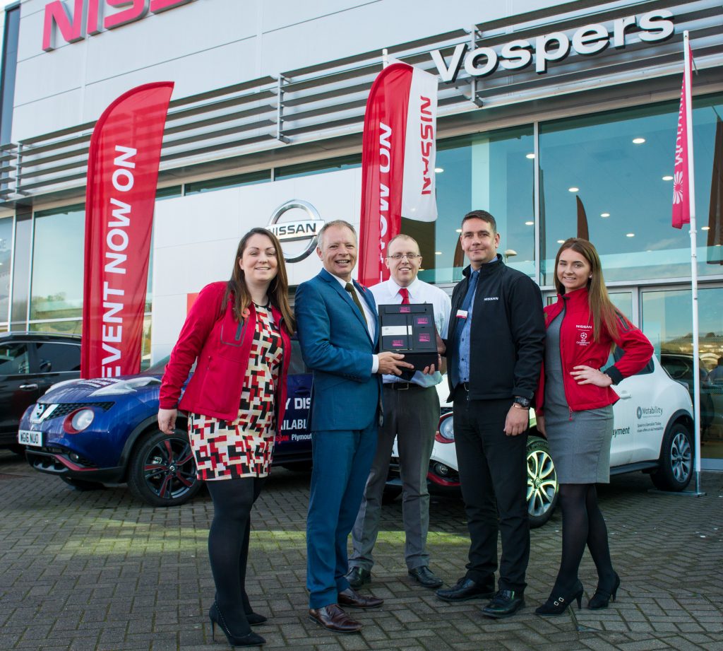 Staff at Vospers Nissan in Plymouth with their award.
