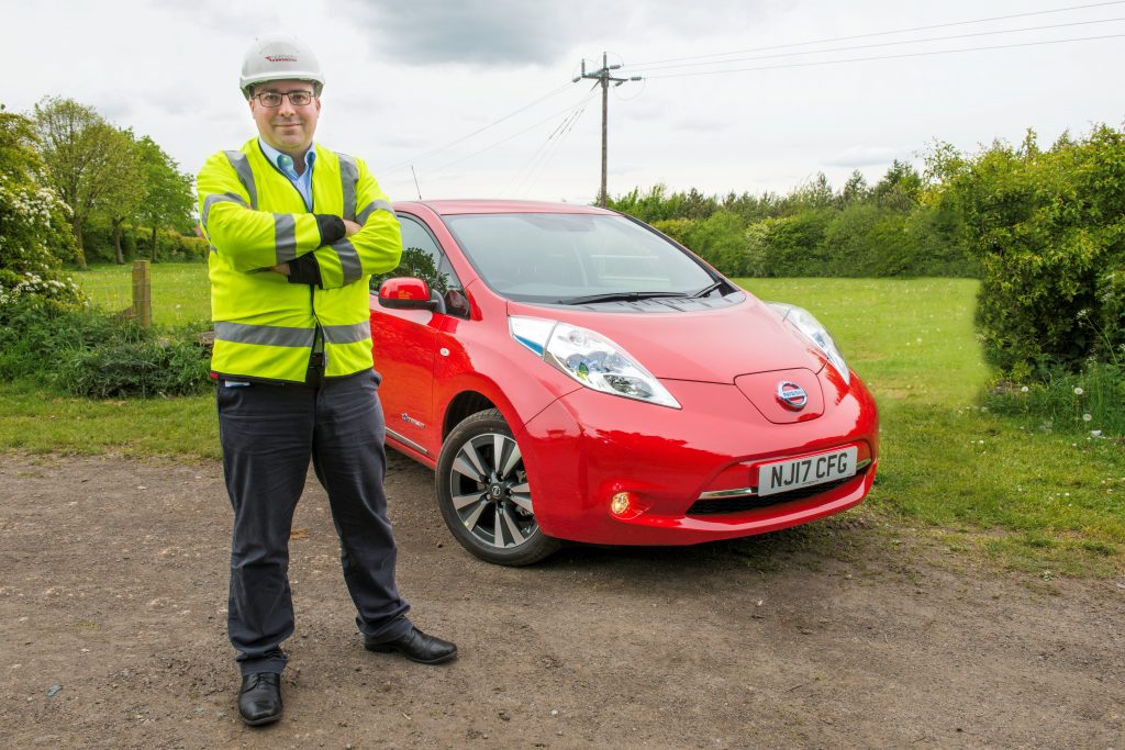 Patrick Erwin, policy and markets director at Northern Powergrid, with the 100% electric Nissan LEAF.