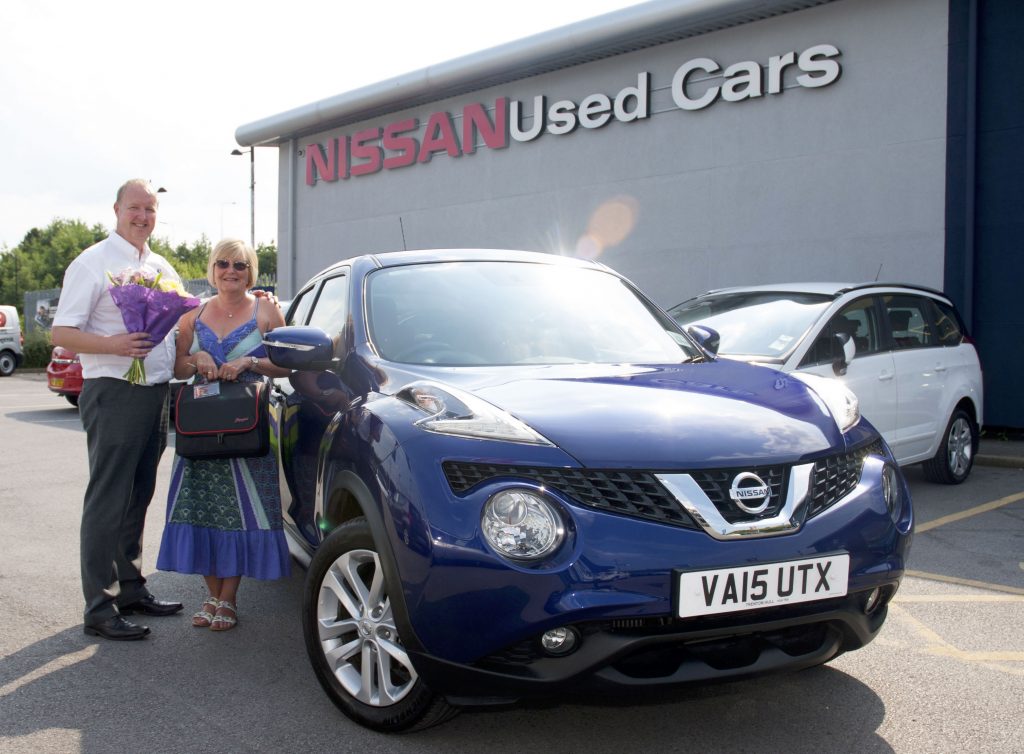 Craig Stevenson, General Manager of Trenton Nissan's Used Car Centre, with Shirley Taylor.