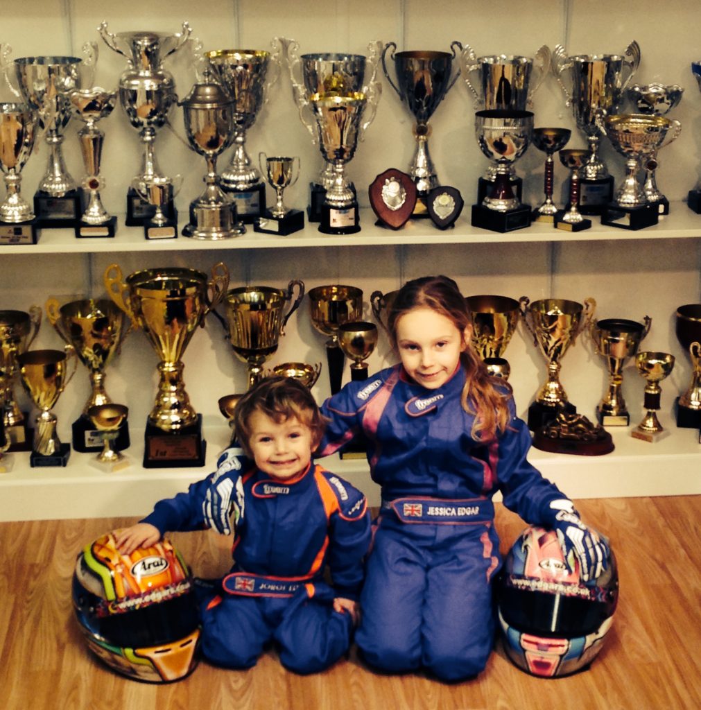 Jorge Edgar, six, and his sister, Jessica, in the family's trophy room.