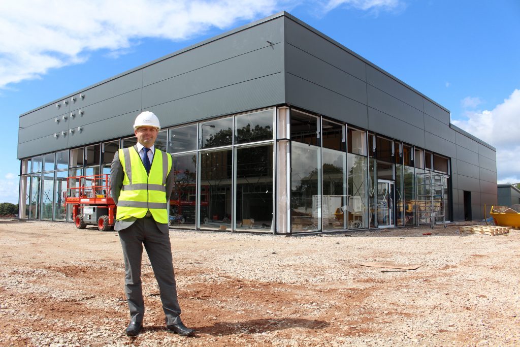 Sales Manager Chris Powell outside the new W R Davies Nissan showroom, due to open in October.